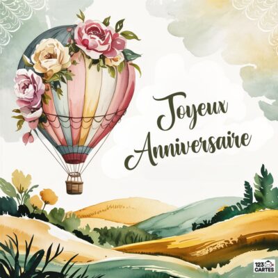 Carte anniversaire romantique avec montgolfière décorée de roses roses dans un paysage aquarellé de collines et végétation, nuages dorés, message : Joyeux Anniversaire en calligraphie élégante